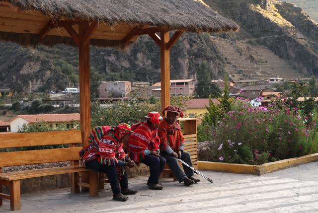 Locals wait for the polls to open during the presidential election runoff at a polling station in Ollantaytambo, department of Cusco, Peru, on June 7, 2026. Peruvians will choose their ninth president in 10 years in a tight runoff election between conservative Keiko Fujimori and leftist Roberto Sanchez, who are trying to woo voters fed up with political chaos and rising crime. (Photo by Jose Angulo / AFP)