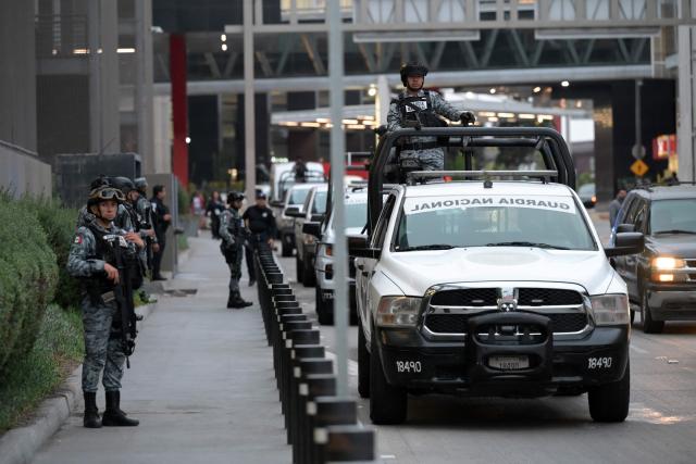 National Guard officers guard the Tijuana International Airport during the arrival of Iran's players in Tijuana, Mexico, on June 7, 2026, ahead of the FIFA 2026 World Cup football tournament. (Photo by Guillermo Arias / AFP)