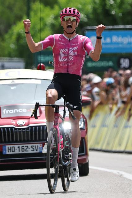 EF Education - EasyPost's French rider Alex Baudin celebrates as he crosses the finish line to win the 1st stage of the Tour Auvergne-Rhone-Alpes cycling race (formerly known as the Criterium du Dauphine), 146,2km between Vizille and Saint-Ismier, in the French Alps, on June 7, 2026. (Photo by Anne-Christine POUJOULAT / AFP)