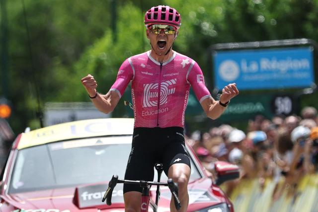 TOPSHOT - EF Education - EasyPost's French rider Alex Baudin celebrates as he crosses the finish line to win the 1st stage of the Tour Auvergne-Rhone-Alpes cycling race (formerly known as the Criterium du Dauphine), 146,2km between Vizille and Saint-Ismier, in the French Alps, on June 7, 2026. (Photo by Anne-Christine POUJOULAT / AFP)