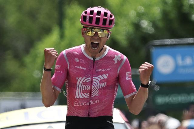 EF Education - EasyPost's French rider Alex Baudin celebrates as he crosses the finish line to win the 1st stage of the Tour Auvergne-Rhone-Alpes cycling race (formerly known as the Criterium du Dauphine), 146,2km between Vizille and Saint-Ismier, in the French Alps, on June 7, 2026. (Photo by Anne-Christine POUJOULAT / AFP)