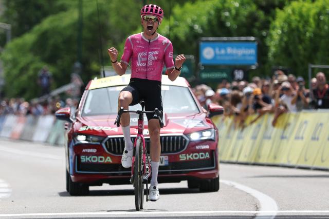 EF Education - EasyPost's French rider Alex Baudin celebrates as he crosses the finish line to win the 1st stage of the Tour Auvergne-Rhone-Alpes cycling race (formerly known as the Criterium du Dauphine), 146,2km between Vizille and Saint-Ismier, in the French Alps, on June 7, 2026. (Photo by Anne-Christine POUJOULAT / AFP)