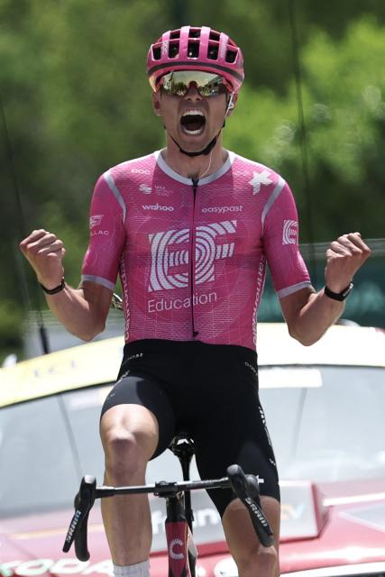 EF Education - EasyPost's French rider Alex Baudin celebrates as he crosses the finish line to win the 1st stage of the Tour Auvergne-Rhone-Alpes cycling race (formerly known as the Criterium du Dauphine), 146,2km between Vizille and Saint-Ismier, in the French Alps, on June 7, 2026. (Photo by Anne-Christine POUJOULAT / AFP)