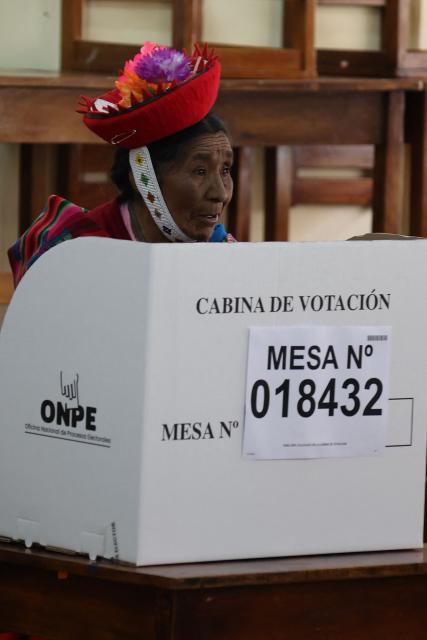 A local resident votes during the presidential election runoff at a polling station in Ollantaytambo, department of Cusco, Peru, on June 7, 2026. Peruvians will choose their ninth president in 10 years in a tight runoff election between conservative Keiko Fujimori and leftist Roberto Sanchez, who are trying to woo voters fed up with political chaos and rising crime. (Photo by Jose Angulo / AFP)