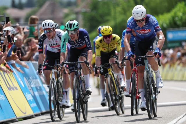 Alpecin-Premier Tech's Belgian rider Ramses Debruyne (R) and Decathlon CMA CGM Team's French rider Léo Bisiaux (C) cycle to the finish line to take second and third place respectively during the 1st stage of the Tour Auvergne-Rhone-Alpes cycling race (formerly known as the Criterium du Dauphine), 146,2km between Vizille and Saint-Ismier, in the French Alps, on June 7, 2026. (Photo by Anne-Christine POUJOULAT / AFP)
