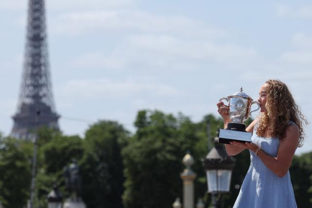 Russia's Mirra Andreeva poses with her Trophy a day after winning the Roland Garros French Open tennis tournament, at the Place de la Concorde with the Eiffel Tower in Paris on June 7, 2026. The 19-year-old became the youngest women's champion at Roland Garros in 34 years with a dominant 6-3, 6-2 victory over Polish qualifier Maja Chwalinska in the final. (Photo by Xavier GALIANA / POOL / AFP)