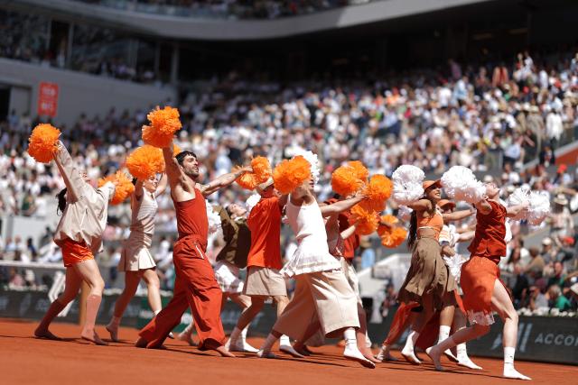 Dancers perform during the ceremony on Court Philippe-Chatrier ahead of the men's final singles match on day 15 of the French Open tennis tournament at the Roland-Garros Complex in Paris on June 7, 2026. (Photo by Thomas SAMSON / AFP)