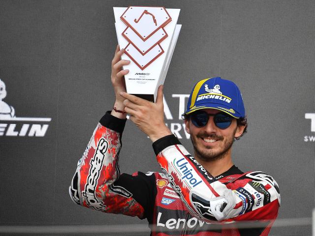 Team Ducati Lenovo Team's Francesco Bagnaia celebrates with the trophy after the Hungarian Motorcycle MotoGP Grand Prix at the Balaton Park circuit in Balatonfokajar, Hungary, on June 7, 2026. (Photo by Ferenc ISZA / AFP)