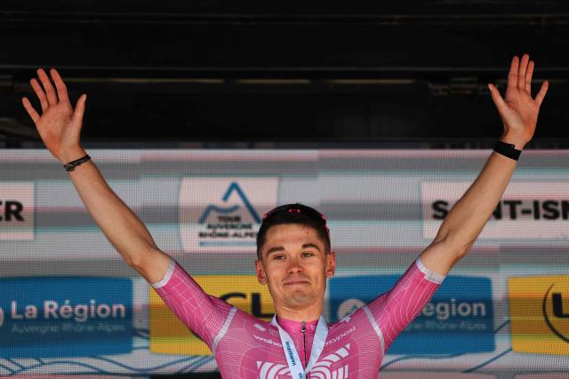 EF Education - EasyPost's French rider Alex Baudin celebrates his victory on the podium after winning the 1st stage of the Tour Auvergne-Rhone-Alpes cycling race (formerly known as the Criterium du Dauphine), 146,2km between Vizille and Saint-Ismier, in the French Alps, on June 7, 2026. (Photo by Anne-Christine POUJOULAT / AFP)