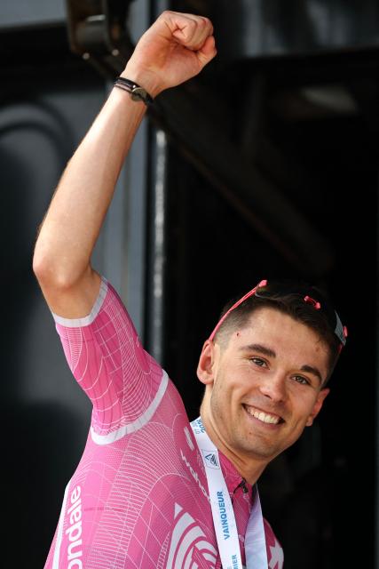EF Education - EasyPost's French rider Alex Baudin celebrates his victory on the podium after winning the 1st stage of the Tour Auvergne-Rhone-Alpes cycling race (formerly known as the Criterium du Dauphine), 146,2km between Vizille and Saint-Ismier, in the French Alps, on June 7, 2026. (Photo by Anne-Christine POUJOULAT / AFP)