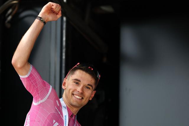 EF Education - EasyPost's French rider Alex Baudin celebrates his victory on the podium after winning the 1st stage of the Tour Auvergne-Rhone-Alpes cycling race (formerly known as the Criterium du Dauphine), 146,2km between Vizille and Saint-Ismier, in the French Alps, on June 7, 2026. (Photo by Anne-Christine POUJOULAT / AFP)
