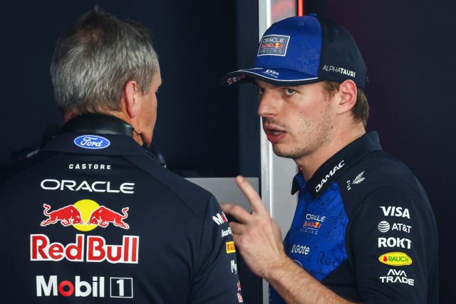 Red Bull Racing's Dutch driver Max Verstappen (R) speaks with a mechanic after taking the car back to the garage as he withdraws from the race during Monaco Formula 1 Grand Prix at the Monaco street circuit in Monaco, ahead of the, on June 7, 2026. (Photo by Yves Herman / POOL / AFP)