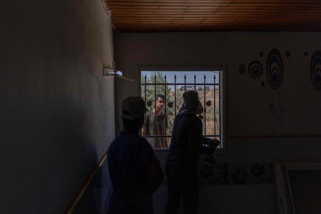 Men dismantle a house at the Bedouin community of Tel Arad, that is being self demolished ahead of a date that was given to the residents by Israeli authorities in Negev desert, in southern Israel on June 7, 2026. (Photo by Ilia YEFIMOVICH / AFP)