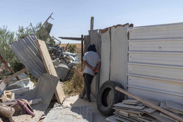 A man stands by his demolished house at the Bedouin community in Tel Arad, that is being self demolished ahead of a date that was given to the residents by Israeli authorities in Negev desert, in southern Israel on June 7, 2026. (Photo by Ilia YEFIMOVICH / AFP)