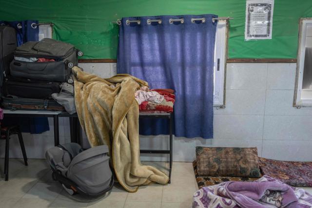 This photograph shows a child sleeping on a makeshift bed table at a school of the Bedouin community in Tel Arad, that is being self demolished ahead of a date that was given to the residents by Israeli authorities in Negev desert, in southern Israel on June 7, 2026. (Photo by Ilia YEFIMOVICH / AFP)