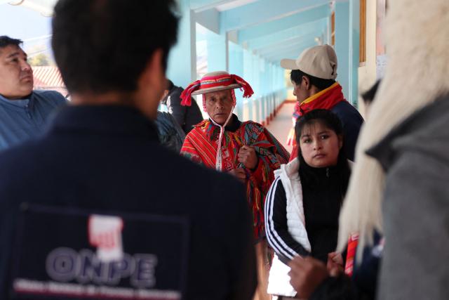 Local residents wait to vote during the presidential election runoff at a polling station in Ollantaytambo, department of Cusco, Peru, on June 7, 2026. Peruvians will choose their ninth president in 10 years in a tight runoff election between conservative Keiko Fujimori and leftist Roberto Sanchez, who are trying to woo voters fed up with political chaos and rising crime. (Photo by Jose Angulo / AFP)