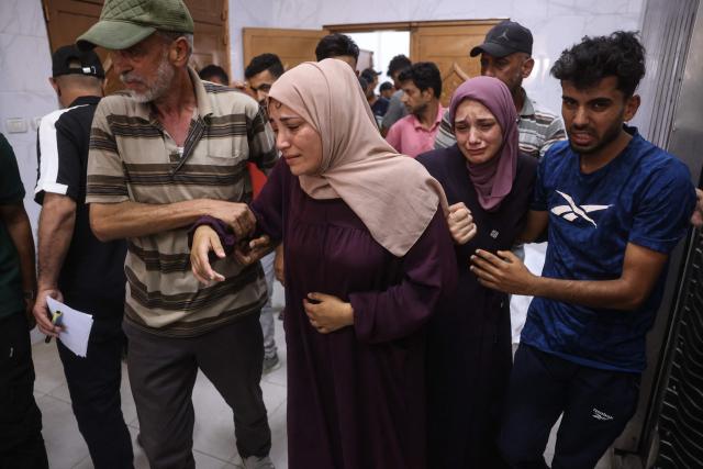 Women mourn victims killed in a reported Israeli airstrike on a police station in the Al-Mawasi district, during a funeral at Nasser Hospital in Khan Yunis, southern Gaza Strip, on June 7, 2026. Gaza's civil defence service said an Israeli airstrike on a police station killed at least five people on June 7, and wounded several, as violence raged unabated across the Palestinian territory. Israel and Hamas continue to trade accusations of near-daily ceasefire violations, keeping the Gaza Strip locked in bloodshed months after a truce took effect in October. (Photo by Bashar Taleb / AFP)