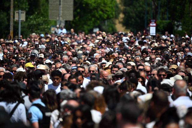 People take part in a silent march in tribute to Lyhanna, an 11-year-old girl found dead on June 4 after having been reported missing since May 29, 2026, in Fleurance, southwestern France, on June 7, 2026. Outrage has erupted in France after it emerged the main suspect Jerome.B, a 41-year-old father of two, had been repeatedly accused of sexually abusing children but no action was taken to protect others. The inscription on the jerseys reads : "Never again !". (Photo by Lionel BONAVENTURE / AFP)