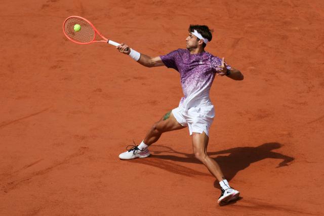 Italy's Flavio Cobolli plays a forehand return to Germany's Alexander Zverev during their men's final singles match on day 15 of the French Open tennis tournament on Court Philippe-Chatrier at the Roland-Garros Complex in Paris on June 7, 2026. (Photo by Alain JOCARD / AFP)