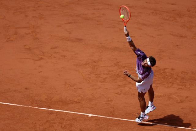 Italy's Flavio Cobolli serves to Germany's Alexander Zverev during their men's final singles match on day 15 of the French Open tennis tournament on Court Philippe-Chatrier at the Roland-Garros Complex in Paris on June 7, 2026. (Photo by Alain JOCARD / AFP)