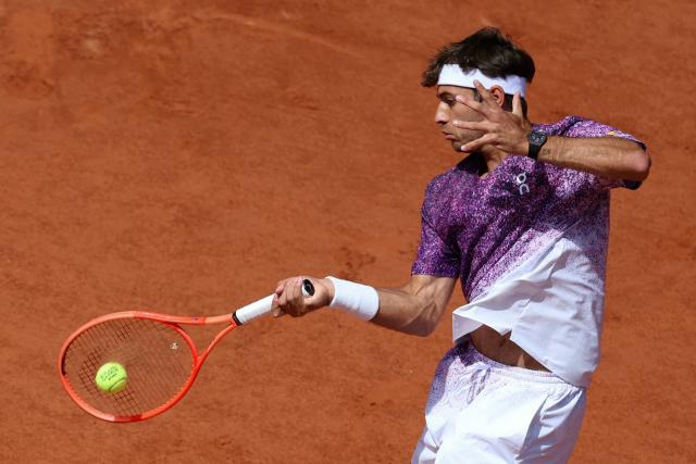 Italy's Flavio Cobolli plays a forehand return to Germany's Alexander Zverev during their men's final singles match on day 15 of the French Open tennis tournament on Court Philippe-Chatrier at the Roland-Garros Complex in Paris on June 7, 2026. (Photo by Alain JOCARD / AFP)