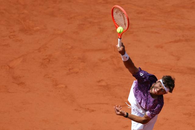 Italy's Flavio Cobolli serves to Germany's Alexander Zverev during their men's final singles match on day 15 of the French Open tennis tournament on Court Philippe-Chatrier at the Roland-Garros Complex in Paris on June 7, 2026. (Photo by Alain JOCARD / AFP)