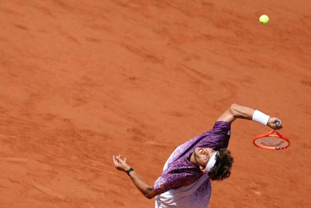Italy's Flavio Cobolli serves to Germany's Alexander Zverev during their men's final singles match on day 15 of the French Open tennis tournament on Court Philippe-Chatrier at the Roland-Garros Complex in Paris on June 7, 2026. (Photo by Alain JOCARD / AFP)