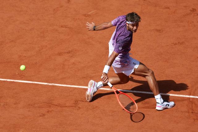 Italy's Flavio Cobolli plays a backhand return to Germany's Alexander Zverev during their men's final singles match on day 15 of the French Open tennis tournament on Court Philippe-Chatrier at the Roland-Garros Complex in Paris on June 7, 2026. (Photo by Alain JOCARD / AFP)