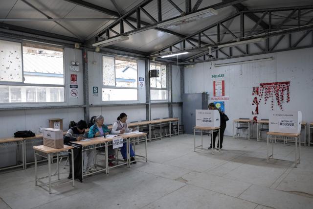 A woman casts her vote during the presidential election runoff at a polling station in San Juan de Lurigancho district, province of Lima, Peru, on June 7, 2026. Peruvians will choose their ninth president in 10 years in a tight runoff election between conservative Keiko Fujimori and leftist Roberto Sanchez, who are trying to woo voters fed up with political chaos and rising crime. (Photo by Anthony Nino de Guzman / AFP)