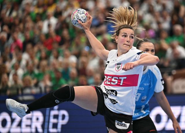 Brest Bretagne's French back Clarisse Mairot scores during the EHF Women's Handball Champions League third place match between Brest Bretagne Handball and CSM Bucuresti in Budapest on June 7, 2026. (Photo by Attila KISBENEDEK / AFP)