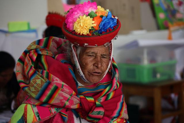 A local resident leaves after voting during the presidential election runoff at a polling station in Ollantaytambo, department of Cusco, Peru, on June 7, 2026. Peruvians will choose their ninth president in 10 years in a tight runoff election between conservative Keiko Fujimori and leftist Roberto Sanchez, who are trying to woo voters fed up with political chaos and rising crime. (Photo by Jose Angulo / AFP)