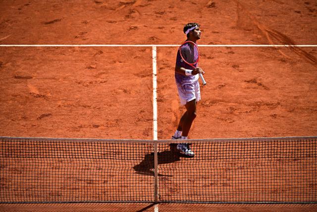 Italy's Flavio Cobolli reacts to a point against Germany's Alexander Zverev during their men's final singles match on day 15 of the French Open tennis tournament on Court Philippe-Chatrier at the Roland-Garros Complex in Paris on June 7, 2026. (Photo by JULIEN DE ROSA / AFP)