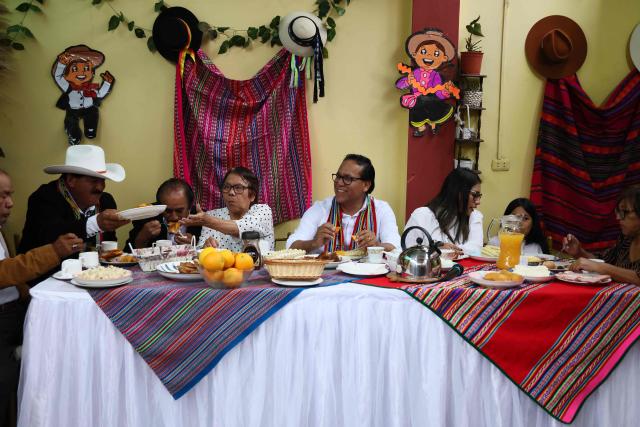 Peru's presidential candidate Roberto Sanchez (C), for the Juntos por el Peru party, attends an election-day breakfast with his wife Claudia Pinazzo (3rd R) and relatives in Huaral, Lima department, Peru on June 7, 2026. Peruvians will choose their ninth president in 10 years in a tight runoff election between conservative Keiko Fujimori and leftist Roberto Sanchez, who are trying to woo voters fed up with political chaos and rising crime. (Photo by Connie FRANCE / AFP)