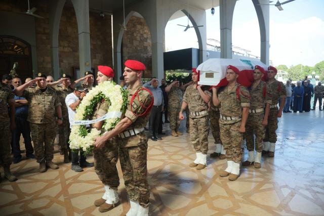Lebanese army soldiers carry the coffin of Brigadier General Wissam Sabra, who was killed in an Israeli strike, during his funeral in Beirut on June 7, 2026. An Israeli strike in southern Lebanon killed three soldiers, Beirut's military said on June 6, as its chief travelled to Pakistan to meet with a key mediator in efforts to end the Middle East war. (Photo by ibrahim AMRO / AFP)