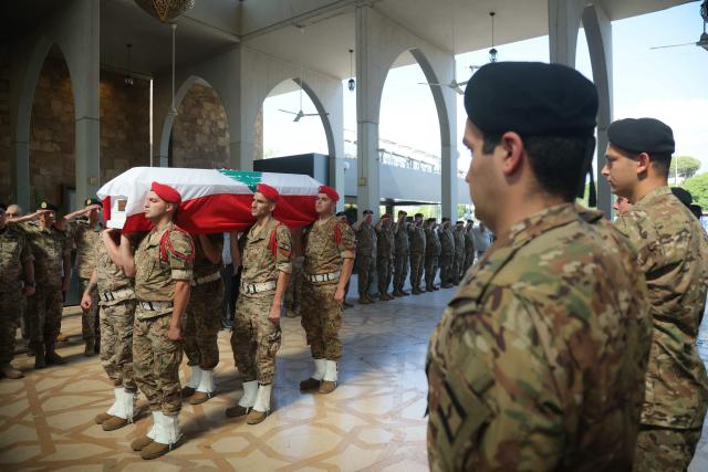 Lebanese army soldiers carry the coffin of Brigadier General Wissam Sabra, who was killed in an Israeli strike, during his funeral in Beirut on June 7, 2026. An Israeli strike in southern Lebanon killed three soldiers, Beirut's military said on June 6, as its chief travelled to Pakistan to meet with a key mediator in efforts to end the Middle East war. (Photo by ibrahim AMRO / AFP)