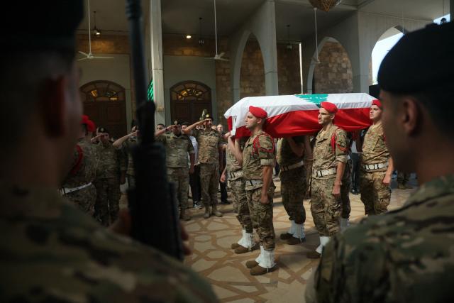 Lebanese army soldiers carry the coffin of Brigadier General Wissam Sabra, who was killed in an Israeli strike, during his funeral in Beirut on June 7, 2026. An Israeli strike in southern Lebanon killed three soldiers, Beirut's military said on June 6, as its chief travelled to Pakistan to meet with a key mediator in efforts to end the Middle East war. (Photo by ibrahim AMRO / AFP)