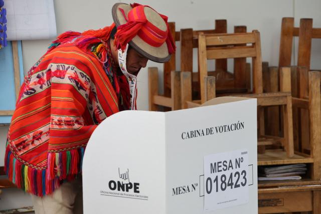 A local resident casts his vote during the presidential election runoff at a polling station in Ollantaytambo, department of Cusco, Peru, on June 7, 2026. Peruvians will choose their ninth president in 10 years in a tight runoff election between conservative Keiko Fujimori and leftist Roberto Sanchez, who are trying to woo voters fed up with political chaos and rising crime. (Photo by Jose Angulo / AFP)