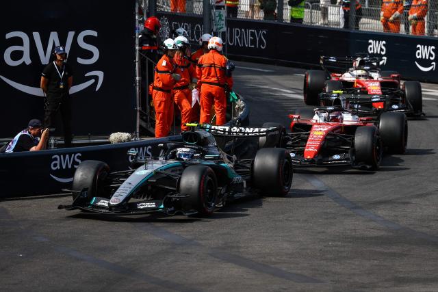 Mercedes' Italian driver Kimi Antonelli, Ferrari's British driver Lewis Hamilton and Ferrari's Monegasque driver Charles Leclerc follow the safety car during Monaco Formula 1 Grand Prix at the Monaco street circuit in Monaco, ahead of the, on June 7, 2026. (Photo by Yves Herman / POOL / AFP)