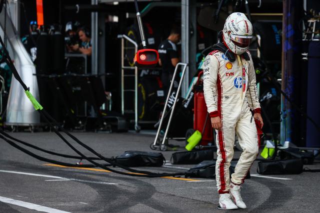 Ferrari's Monegasque driver Charles Leclerc reacts after coming back to the pit after crashing and withdrawing from the race during Monaco Formula 1 Grand Prix at the Monaco street circuit in Monaco, ahead of the, on June 7, 2026. (Photo by Yves Herman / POOL / AFP)