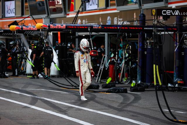 TOPSHOT - Ferrari's Monegasque driver Charles Leclerc reacts after coming back to the pit after crashing and withdrawing from the race during Monaco Formula 1 Grand Prix at the Monaco street circuit in Monaco, ahead of the, on June 7, 2026. (Photo by Yves Herman / POOL / AFP)