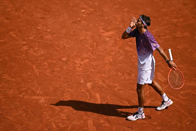 Italy's Flavio Cobolli reacts to a point against Germany's Alexander Zverev during their men's final singles match on day 15 of the French Open tennis tournament on Court Philippe-Chatrier at the Roland-Garros Complex in Paris on June 7, 2026. (Photo by JULIEN DE ROSA / AFP)