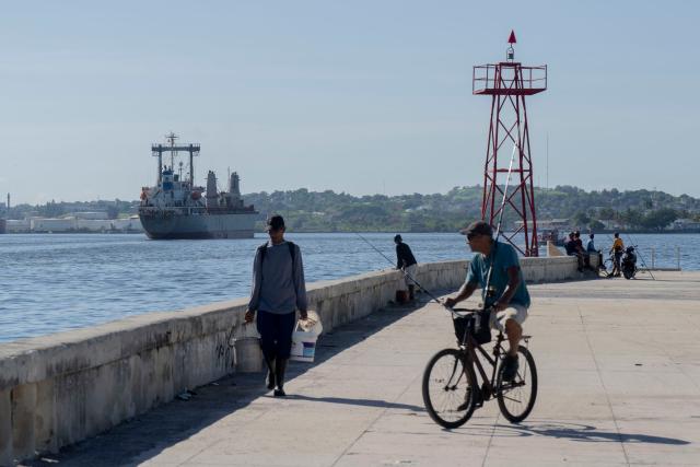 The Asian Katra, a Panama-flagged cargo ship, arrives in Havana Bay carrying Mexican humanitarian aid, in Havana, on June 7, 2026. A new shipment of humanitarian aid from Mexico arrived in Cuba as the island grapples with a severe economic and energy crisis nearly four months after the imposition of an oil blockade by Washington. (Photo by Pablo PORCIUNCULA / AFP)