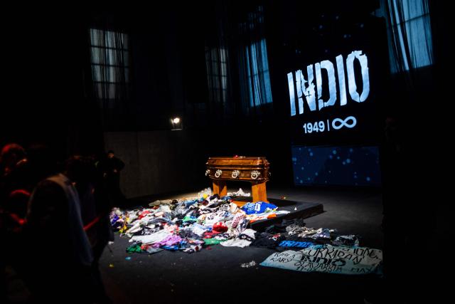 Fans queue to pay their respects to the coffin with the remains of Carlos Alberto "Indio" Solari, the iconic Argentine rock musician and former lead singer of Patricio Rey y sus Redonditos de Ricota, at Villa Dominico, Buenos Aires Province, on June 7, 2026. The singer died in Parque Leloir, Buenos Aires Province, on June 5 at the age of 77. (Photo by TOMAS CUESTA / AFP)