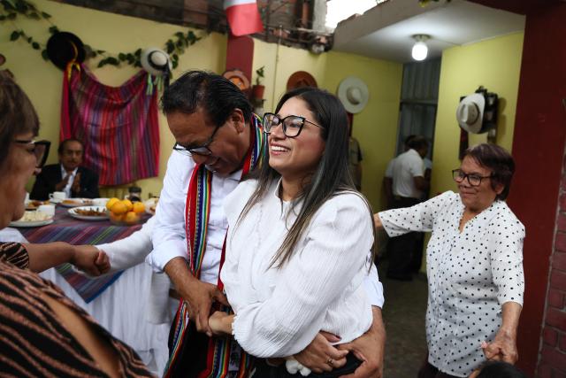 Peru's presidential candidate Roberto Sanchez, for the Juntos por el Peru party, dances with his wife Claudia Pinazzo during an election-day breakfast in Huaral, Lima department, Peru on June 7, 2026. Peruvians will choose their ninth president in 10 years in a tight runoff election between conservative Keiko Fujimori and leftist Roberto Sanchez, who are trying to woo voters fed up with political chaos and rising crime. (Photo by Connie FRANCE / AFP)