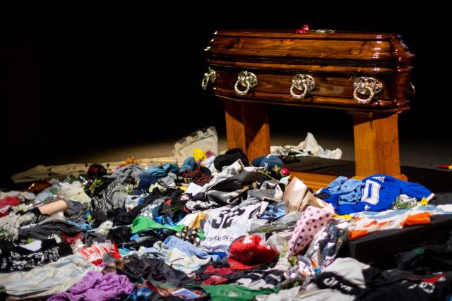 The coffin with the remains of Carlos Alberto "Indio" Solari, the iconic Argentine rock musician and former lead singer of Patricio Rey y sus Redonditos de Ricota, is pictured as fans queue to pay their respects at Villa Dominico, Buenos Aires Province, Argentina, on June 7, 2026. The singer died in Parque Leloir, Buenos Aires Province, on June 5 at the age of 77. (Photo by TOMAS CUESTA / AFP)