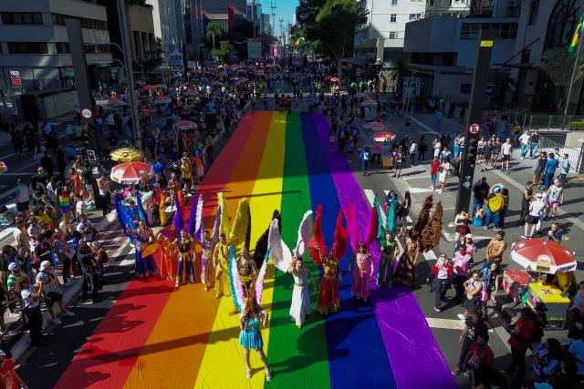 This aerial view shows revellers taking part in the 30th LGBT Pride Parade in Sao Paulo, Brazil, on June 7, 2026. (Photo by Miguel SCHINCARIOL / AFP)