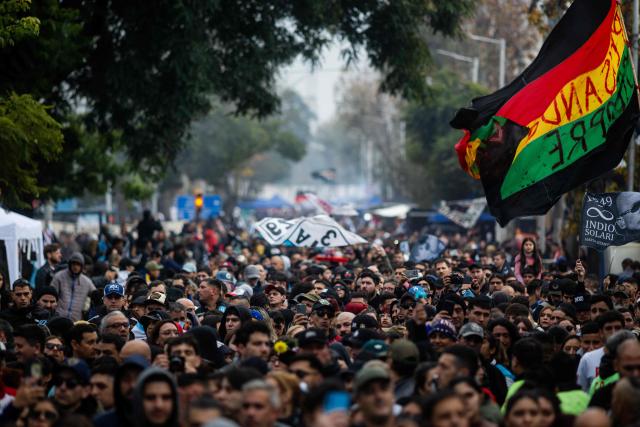 Fans wait to pay their respects to the coffin with the remains of Carlos Alberto "Indio" Solari, the iconic Argentine rock musician and former lead singer of Patricio Rey y sus Redonditos de Ricota, at Villa Dominico, Buenos Aires Province, Argentina, on June 7, 2026. The singer died in Parque Leloir, Buenos Aires Province, on June 5 at the age of 77. (Photo by Tomas CUESTA / AFP)