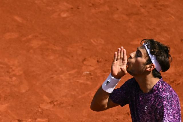 Italy's Flavio Cobolli reacts to a point against Germany's Alexander Zverev during their men's final singles match on day 15 of the French Open tennis tournament on Court Philippe-Chatrier at the Roland-Garros Complex in Paris on June 7, 2026. (Photo by JULIEN DE ROSA / AFP)