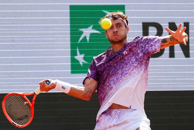 Italy's Flavio Cobolli plays a forehand return to Germany's Alexander Zverev during their mens final singles match on day 15 of the French Open tennis tournament on Court Philippe-Chatrier at the Roland-Garros Complex in Paris on June 7, 2026. (Photo by Dimitar DILKOFF / AFP)