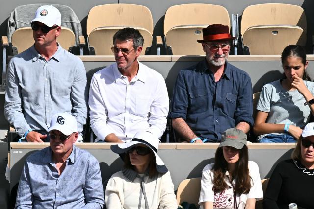 French former football player and actor Eric Cantona (top row 2R) watches Germany's Alexander Zverev playing against Italy's Flavio Cobolli during their mens final singles match on day 15 of the French Open tennis tournament on Court Philippe-Chatrier at the Roland-Garros Complex in Paris on June 7, 2026. (Photo by JULIEN DE ROSA / AFP)